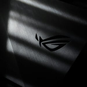 A monochrome photo of the Republic of Gamers logo with dramatic light and shadow effects.